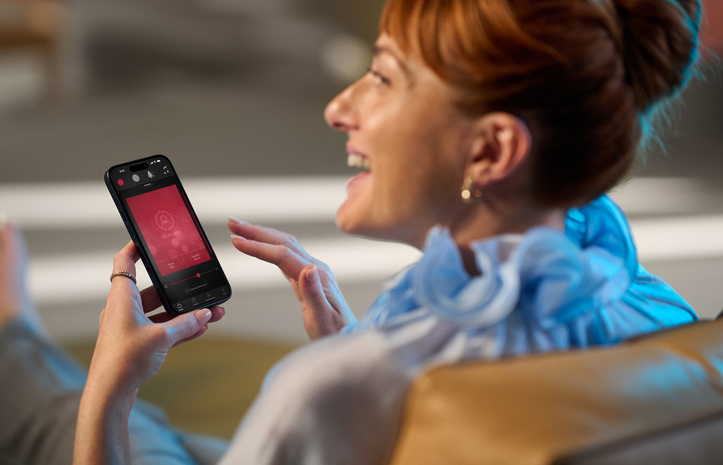 Woman using ReSound app